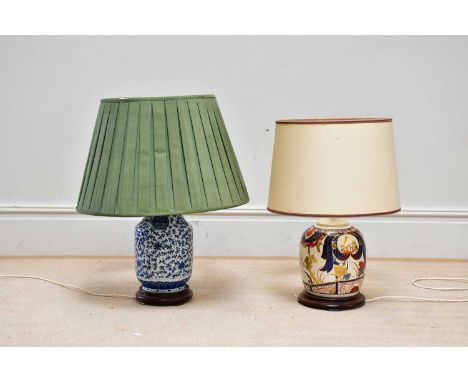 A Chinese blue and white vase, converted to a table lamp, on hardwood stand, height 39cm, with a Japanese style table lamp (2