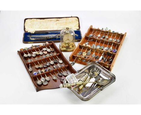 A collection of assorted plated items including souvenir spoons, a bowl with swing handle, a cased carving set and an anniver