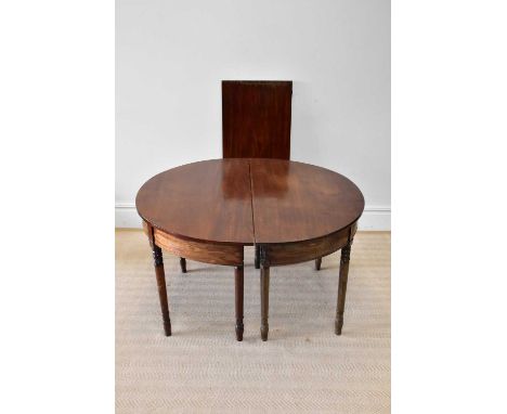 An early 19th century mahogany D-end dining table, with one central leaf, on turned legs, height 70cm, overall length 165cm, 