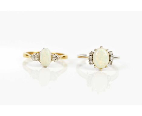 An 18ct white gold diamond and opal set dress ring, size J, and an 18ct gold and platinum diamond and opal dress ring, size N