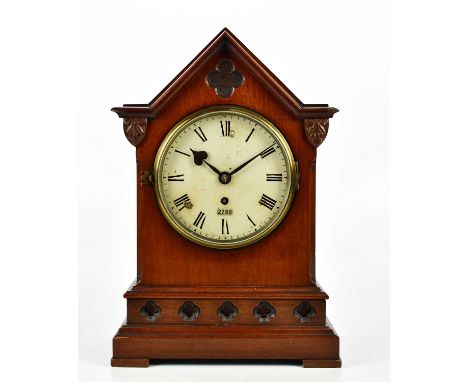 RAILWAY INTEREST; a 19th century mahogany cased mantel clock of architectural form with applied carved shields above the pain