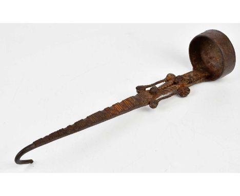 A 17th century wrought iron ladle with open decoration of simple rivets, length 34cm.