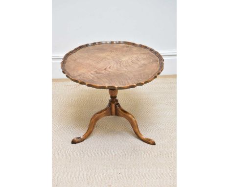 A George III style walnut tripod table, diameter 59cm.