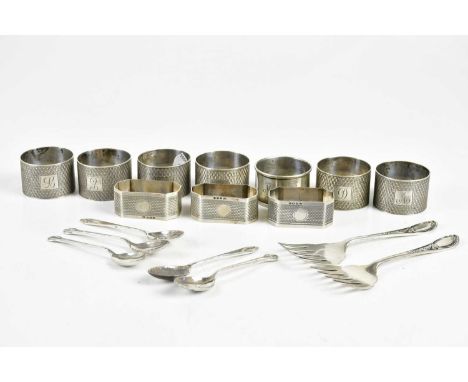 VINERS LTD; a set of six George V hallmarked silver napkin rings with engine turned decoration, Sheffield 1935, four further 