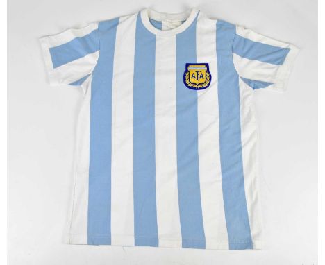 DIEGO MARADONA; a 1986 retro style Argentina football shirt, signed to the reverse.Condition Report: Creasing and light gener