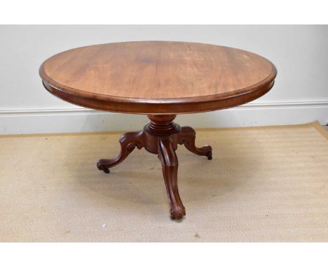 A Victorian mahogany tilt-top breakfast table on baluster and scrolling legs, diameter 114cm.