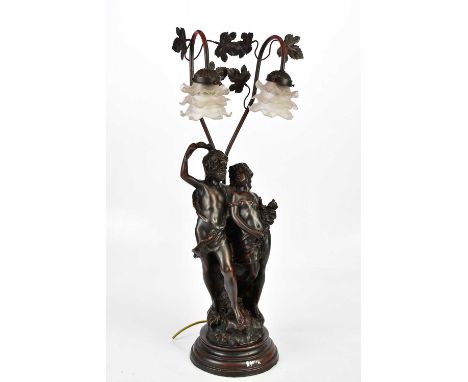 A modern bronzed figural table lamp with two frosted floral glass shades above a young couple, height 77cm.Condition Report: 