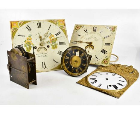 A collection of longcase clock faces, movements and parts, to include an 18th century movement, the brass face set with appli