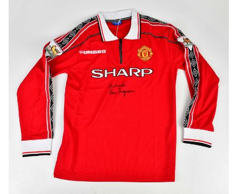 ALEX FERGUSON; a Manchester United Treble Winners signed retro style football shirt, signed to the front, size L.Condition Re