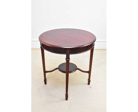 An early 20th century mahogany occasional table on spade feet, height 70cm, diameter 65cm.
