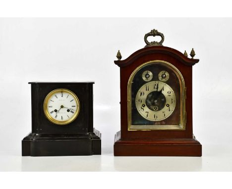 An early 20th century mahogany bracket clock, with four pineapple finials above the silvered dial set with Arabic numerals an