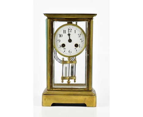 A late 19th century French brass four-glass mantel clock, the white dial set with Arabic numerals, height 26cm.