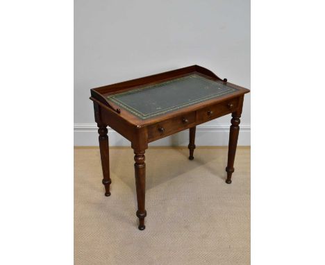 A 19th century mahogany two drawer writing table with turned tapering legs, height 82cm, width 92cm, depth 53cm.
