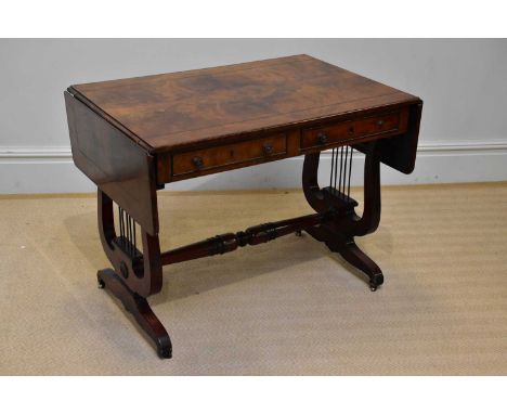 A Regency mahogany sofa table, with two real and two dummy drawers, on lyre shaped end supports, and fitted castors, height 7