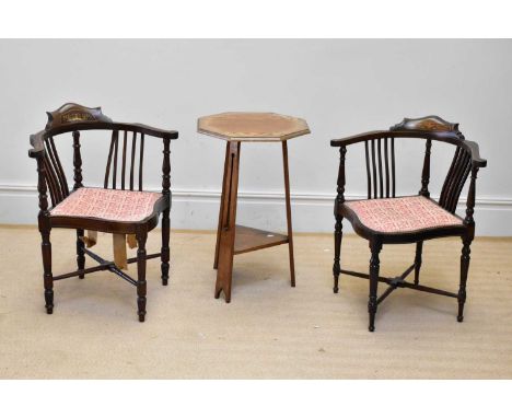 A pair of Edwardian inlaid mahogany corner chairs on turned column legs and an oak Arts and Crafts two tier occasional table,