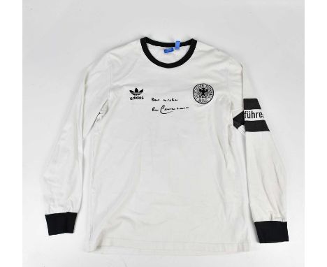 BECKENBAUER; a signed Germany retro style football shirt, signed to the front, size L.Condition Report: Creasing and light ge