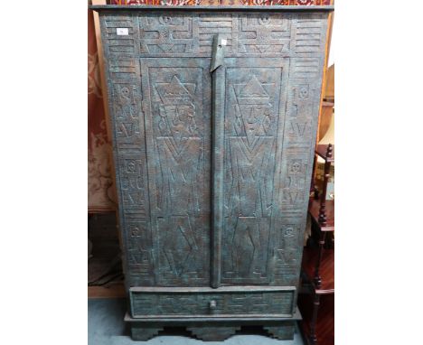 A 20th century faux stone Aztec style two door cabinet, 150cm high x 85cm wide x 29cm deep Condition Report:Available upon re