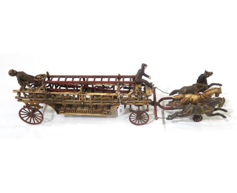 A cast iron model of an early horse-drawn fire engine, measuring approx. 79cm in overall length Condition Report:Available up
