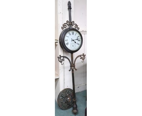 A 20th century free standing architectural style double sided garden clock, 173cm high Condition Report:Available upon reques