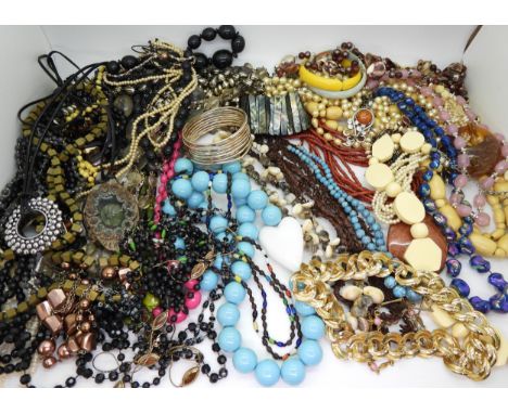 A large collection of vintage costume jewellery to include, a retro ceramic pendant, signed Millar, statement necklaces in ca