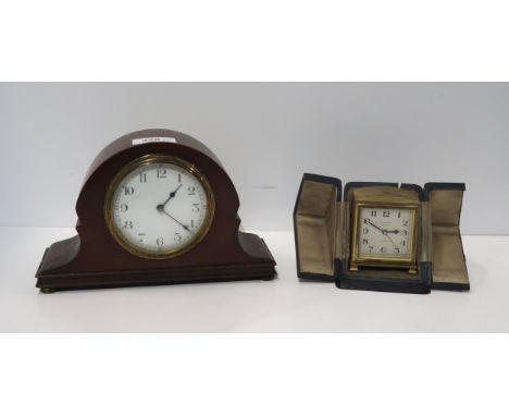 A small Zenith 8 day alarm clock, in travel case, retailed by Edward Glasgow, together with a small French mahogany mantle cl