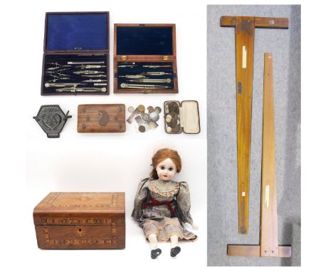 Two cased sets of draughtsman's instruments, two large drawing squares, a chrome AA grille badge, mixed British pre-decimal c