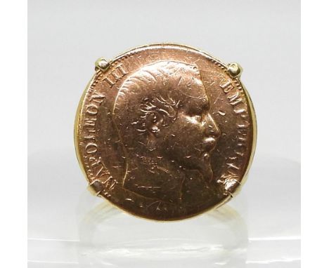 A bright yellow metal ring set with a 20 Francs gold coin dated 1858, finger size R, weight 12.8gms Condition Report:Availabl