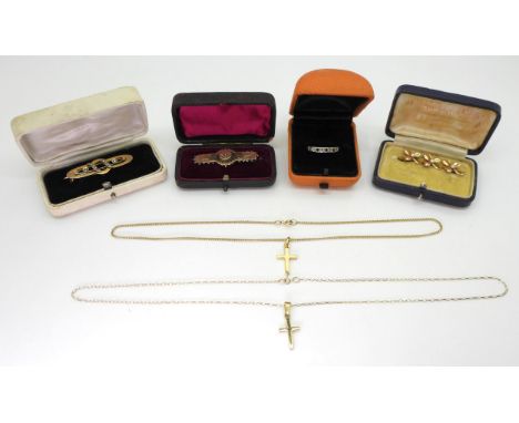 Two 9ct gold crosses on chains, a 10k gold pearl three shamrock brooch, and two others and a 9ct gold sapphire and diamond ac