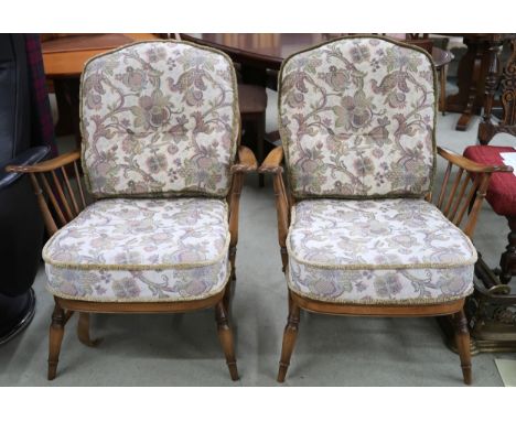 A pair of mid 20th century Ercol elm and beech rail backed armchairs, 90cm high x 70cm wide x 90cm deep (2) Condition Report: