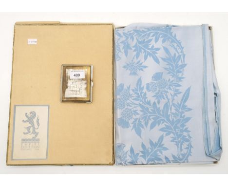 A boxed blue damask table cover from the Empire Exhibition Scotland, 1938, together with an Indian souvenir cigarette case Co