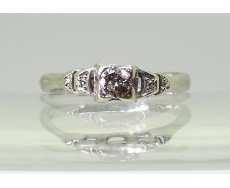 An 18ct gold diamond engagement ring, the top is vintage and set with a 0.20ct diamond with further rose cut diamonds set to 