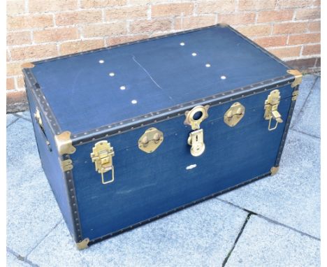 A BRASS BOUND CANVAS SHIPPING TRUNK  with original 'Overpond' label, 92cm wide 52cm deep 50cm high