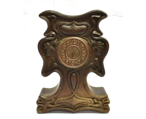 AN ART NOUVEAU STYLE MANTLE CLOCK  with heavy carved oak case, 29cm high