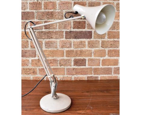 A 1960s BEIGE COLOURED ANGLEPOISE LAMP  on circular spreading base, push button on/off switch to shade