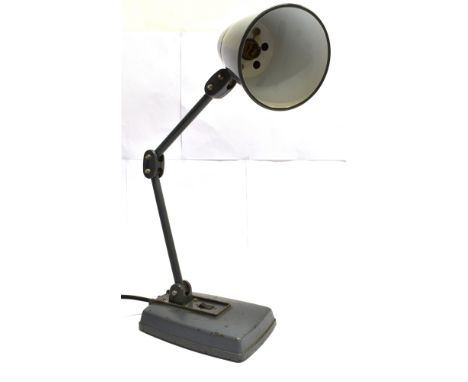 AN INDUSTRIAL ADJUSTABLE FACTORY DESK LAMP  grey metal conical shade, hinged arm and cast metal base with on/off switch stamp