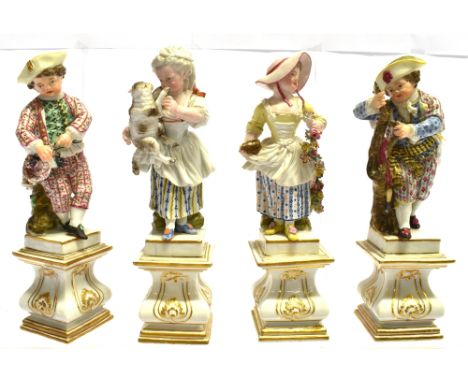 A SET OF FOUR MEISSEN MARCOLINI PERIOD FIGURES OF CHILDREN  polychrome enamelled with gilt highlights, standing on Neo-classi