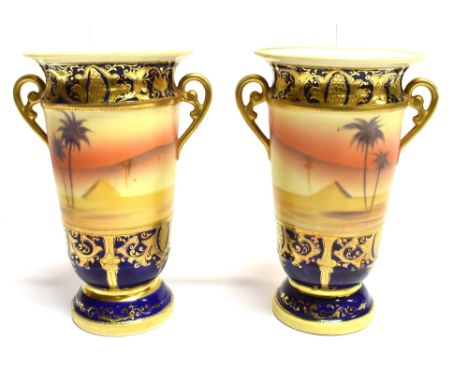 A PAIR OF NORITAKE PORCELAIN TWIN HANDLED VASES  hand-painted Bedouin Arabian scenes, with gilt overlay detail to the border,
