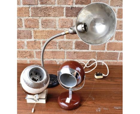 A VINTAGE DESK LAMP  with chrome shade and adjustable swan neck, on cast iron base with label 'UNIVERSA TRADE MARK THE 10 IN 