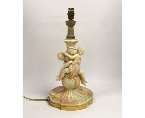 A large Royal Worcester blush ivory cherub lamp base, 40cms not including light fitting