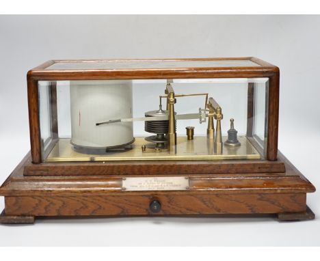 A Negretti and Zambra oak-cased barograph, number R/20613 with plaque reading ‘To C.C. Prigge as a token of esteem from his C