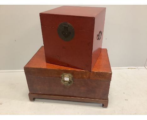 A Chinese leather bound trunk on stand and a small Chinese lacquer trunk, larger width 79cm, depth 49cm, height 44cm