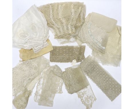 A collection of mostly 19th century French and English needle and bobbin lace trimmings, white worked sleeves, a black silk s