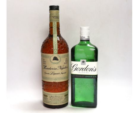 A bottle of Mandarine Napoleon brandy and a Gordon's gin