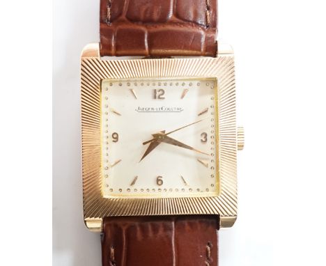 A gentleman's 18ct gold Jaeger LeCoultre manual wind dress wrist watch, with square dial, milled bezel and baton and quarterl