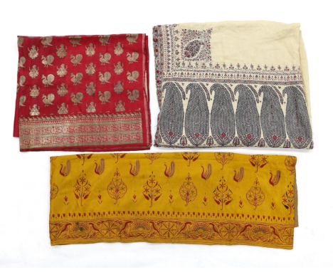 A 19th century fine cream woven Kashmiri shawl with blue and red teardrop design borders, an early 20th century gold satin pe
