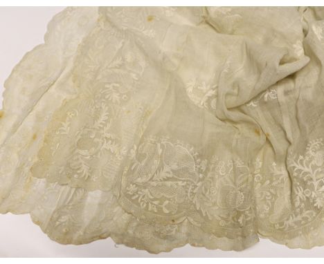 An 18th century Dresden worked apron, a white worked fine lawn stole, two panels of linen ribbon work, a ladies lace bonnet a