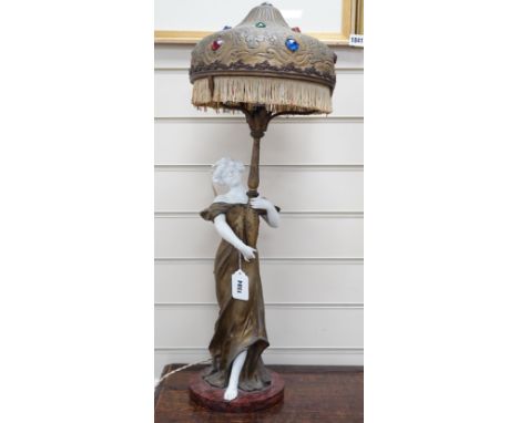 An Art Nouveau gilt-spelter and bisque figural table lamp, on rouge marble base, jewelled gilt-spelter shade, 73cm tall