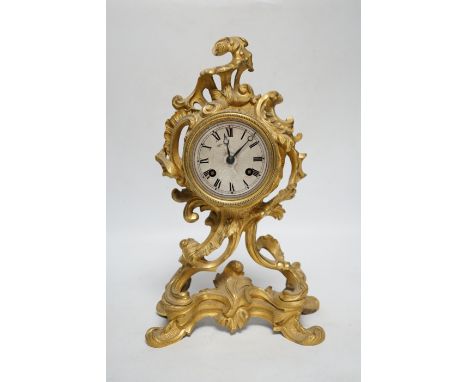 A 19th century French rococo-style ormolu mantel clock with Raingo movement striking on a bell (missing pendulum), 29cm