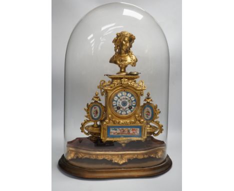 A late 19th century French gilt-spelter mantel clock with enamel panels, under glass dome, 54cm