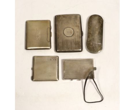 Two George V engine turned silver compacts, largest 83mm, a silver mounted aide memoire wallet, a silver spectacles case and 